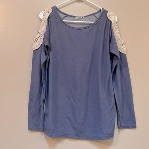 Blue shirt with crochet shoulder cutouts